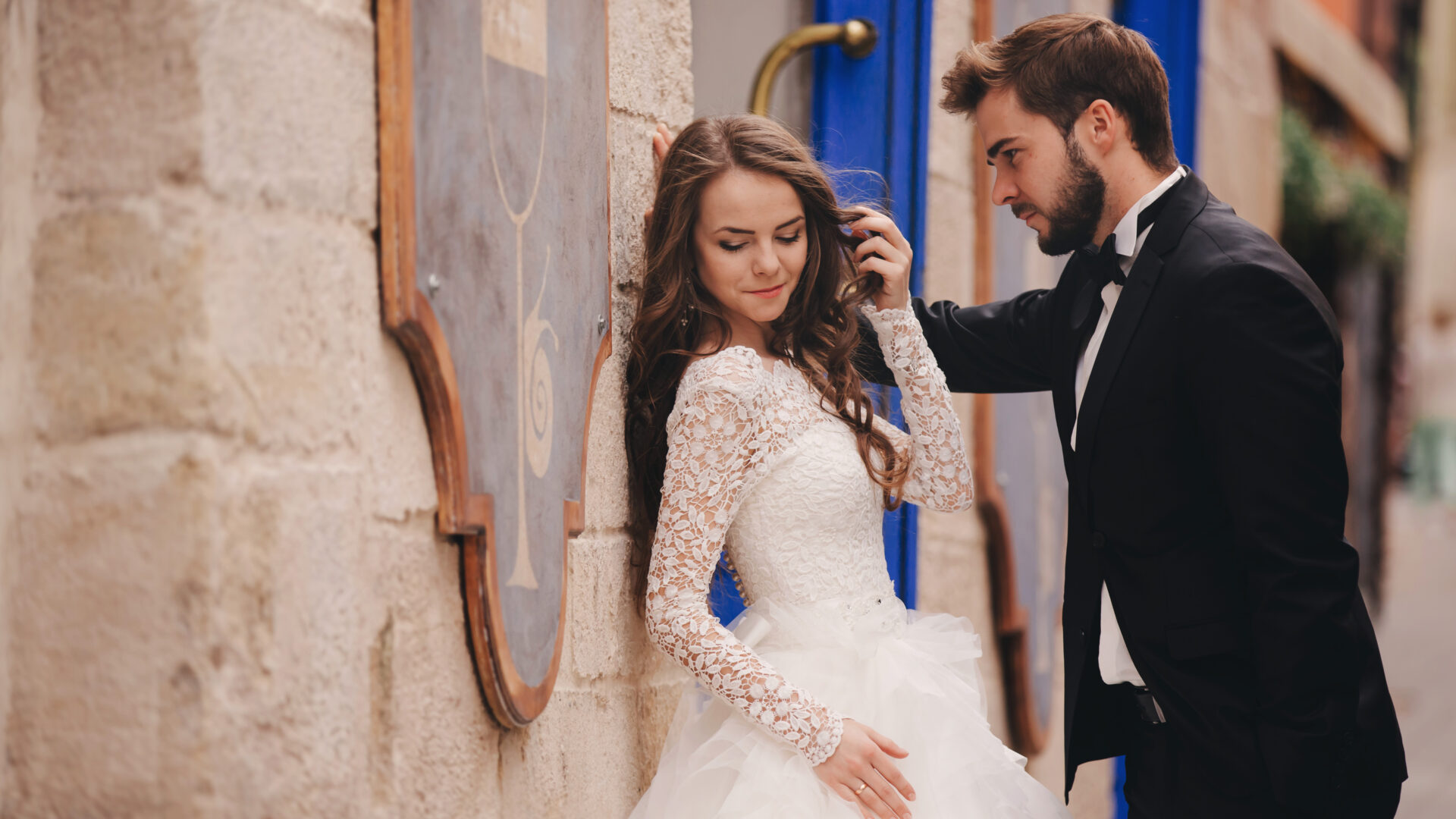 Wedding couple hugging in the old city