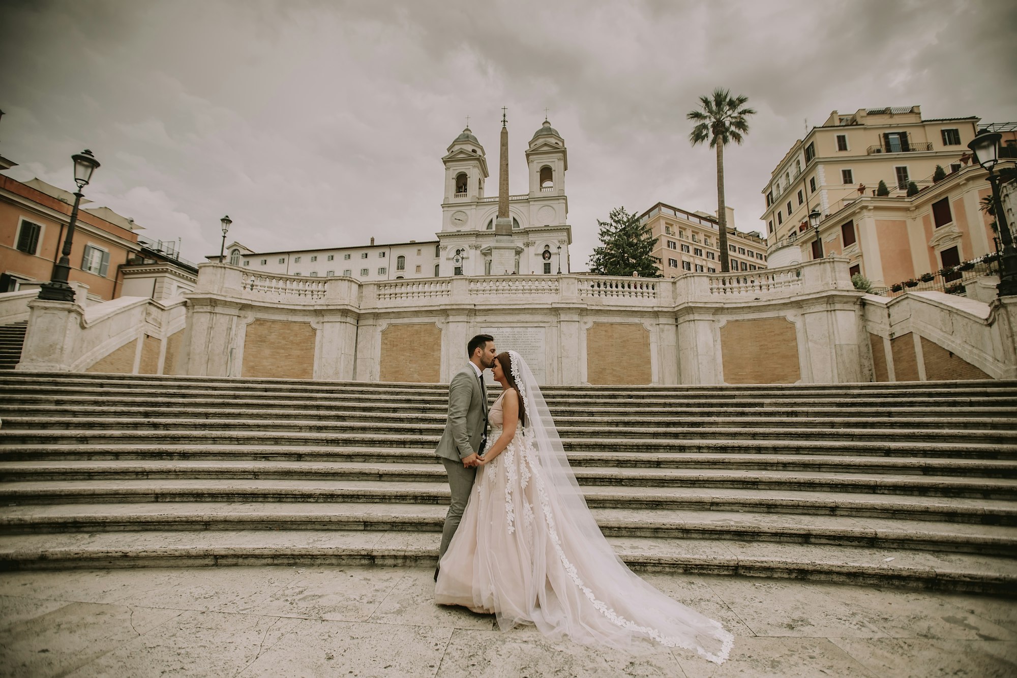 Young wedding couple on Spanish stairs in Rome